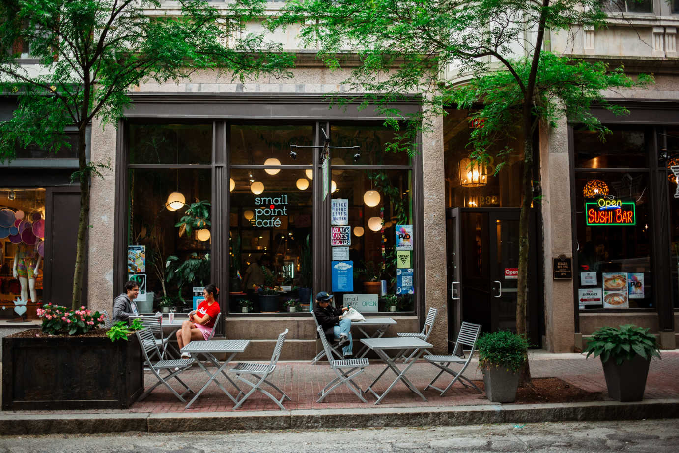 Exterior, sidewalk seating area with tables and seats